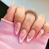 Coquette style Custom Singapore handmade press on nails with blush tones, bows, and lace details